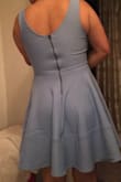I love this dress, material is very stretchy. The fabric feels and look like an expensive dress, and feel super comfortable!! - Isela V.