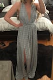 I was a little nervous ordering this in an XS because I'm usually a small in Lulus dresses but I'm so glad I did. I'm short so it's still long on me but with some heels it's perfect. The elastic under the bust chinches in my waste nicely so it looks like I have a waist in it which is great. The open back and deep cut in the front are sexy but still classy and I feel super secure in it without a bra. Bottom is flowy and doesn't hug in on my curves which I like as well. I can't wait to wear it! - Kelsey W.