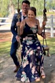 The back is a little bit longer than the front, which made it flow beautifully and helped me not step on my dress like someone at my height usually has issues with. - Melissa W.