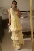 Love the color, and love the ruffles such a fun girly dress! The issue is it's sooooo long. I'm 5'4 and I'm wearing my highest heels with platforms and still the dress is dragging on the floor. The way the dress is made not sure how the alterations will go with the ruffles w/o ruining the pattern, but something must be done! Regardless of the sizing experts, if you're not tall I'd opt for another dress unless you're willing to invest more money into it. Also, the zipper is very fragile. - Mara D.