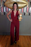 This is a very cute jumpsuit if you can get it on and off. The strap across the back makes it nearly impossible; I wound up cutting the strap and sewing in a hook and eye. It runs slightly small. - Misty D.