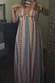 This dress is so light and will be perfect for my vaca in Cabo. Great length to be able to dress up with wedges or down with sandals. Keep in mind you can't wear a bra, but you tie the straps so you can adjust it to fit comfortably. - Danielle D.