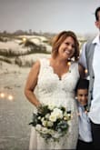 I ordered this dress to wear for my casual beach wedding. I had high expectations after reading the reviews, and this dress absolutely lived up to them. I was worried the top would be very revealing, but the coverage was perfect. The lace is beautiful, but also sturdy enough to prevent snags. It is a heavy, well made dress, but was not too hot for an April beach wedding. I received so many compliments, and could not have been happier with the purchase! - Ashley L.