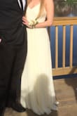 I needed to sew the front of the dress closed but it fit pretty nice except for that. The color is a bit of a light creamy yellow in my opinion and it had a rich look to it. - Julie N.