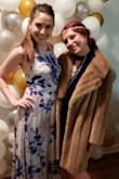 The dress is beautiful. I love the crisscross back! I am 5'4.5, and with a 3 inch heel I was able to wear the dress without a hem, but it did catch under my feet often and I spent most of the night of a party using my hands to hoister it up so I wouldn't step on it. If you plan to do a lot of dancing in this dress or wear it with a practical use (ie. Not just take engagment pictures in it), then you'll want to hem it. Also, it clearly won't wear with a bra with any sort of backstrap, so stickies or other front cup bras are a must. I wore a bralette underneath for a less formal party because I didn't have the correct undergarments and it worked fine for that event. If I was going to a wedding or some sort of formal, I would have needed to get the appropriate pieces. Other than that I must tell you ladies that this dress made me want to dance all night long! It's very comfortable, excellent quality, and the skirt is super flowy and fun to dance in. 
P.S. please excuse the awk photo. just trying to show yall the side of the dress  ;) - Abby H.