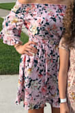 I loved this dress. Wore it to a wedding. It's a nice length. The only issues is I steamed it perfectly and as I wore it, it's that material that wrinkles easy. Since there is a floral print you couldn't tell that much. Got my normal size small. - Jennifer I.