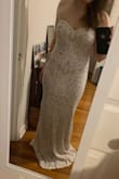 I was looking for a fitted wedding dress, but didn't want to spend as much as most wedding dresses are. This dress is perfect! I was worried it might look cheap but it doesn't at all! I love the fit, the material is a little stretchy and comfortable. There is a little bit of built in boning in the top as well. A little long for me, but dresses usually are! I would highly recommend this dress and I can't wait to wear it! - Casey B.