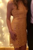 Loved wearing this dress to a spring wedding! Very unique and the color was perfect. Not an annoying yellow at all! I would not classify it at a body con dress, it was not tight at all. Would recommend - Tamara K.