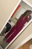 This jumpsuit is killer. The color makes the whole look. If you're comfortable with a lot of back and not being able to wear a bra, this is for you! I would order a size smaller (I normally wear a medium in a jumpsuit, but this material is lose and stretchy to it would've worked in a small better). - Noel I.