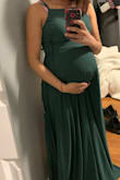 I loved everything about the dress the minute I saw it. I'm currently 33 weeks pregnant and I will be using the dress for my baby shower. The material is beautiful and the color Is accurate just the Hunter Green I was looking for. The only downfall was that it's pretty long so I had to send it to get cut since I'm petite. Other than that it's a beautiful dress! It helps that the straps in the back adjust if you're pregnant it's a plus since it's so hard looking for pregnancy dresses. - Cynthia R.