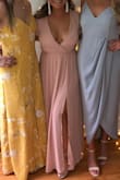 I wore this to my sorority formal and LOVED IT! I got so many compliments all night on it! The elastic waist was super flattering and I loved the way it covered my shoulders and the best part is the high slit! - Maddy H.