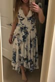 This dress is so cute on! It is a little low cut though so if you have a larger chest you may need to pin it or wear something underneath. I have it pinned in the photo or it was a real deep V. I really like the high low nature and that it has cute little sleeves. Since I am so short I think I might still need it hemmed even with heels though for it to give the illusion it is supposed to. - Alexandra B.