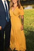 This dress is so comfortable. It took a bit to learn how to wrap it properly, but I watched a YouTube video for that! Being 5'2" it's really long, I wore 4 inch wedges, it flows when you walk so it wasn't that big of an issue. I could've definitely made a XS work since there is a lot of fabric. But I am pleased with the dress. The color is beautiful. - Brittany M.