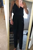 This jumpsuit was cute!! The legs were too short. The material around the ankles is tight, which I love, but they came up a little too high (especially with shoes on). The back of the suit is opened and kept falling below my bra. The fit around my waist & chest was comfortable. - Shelley G.