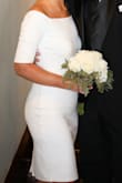 I wore this dress for my New Years Eve wedding. I was looking for something simple and classic and this dress was perfect! I received so many complements at the wedding and continue to receive complements when people see our wedding pictures. The fabric is a very nice thickness and has a nice amount of stretch. It was ideal for our winter wedding, but wouldn't be too heavy for a spring event. It is very well made, very good quality, and comfortable. I did wear shape wear underneath to smooth out any unwanted lines or wrinkles as well as a strapless bra. If you are looking for a classic dress for a wedding, bridal shower, or bachelorette party, this dress is perfect! - Jessica F.