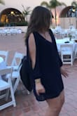 Here's a very blurry (candid) picture, but I love this dress! It's loose enough without being boxy and too large, and it's just the right length - it wasn't too short that it would make me worried while dancing or anything. - Emily E.