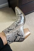 I absolutely love the booties. It's the perfect height, color and fit but the material is very stiff and can be little uncomfortable. I'm hoping in time is soften up after wear. also the heels are kind of slippery so you need to make sure you scuff them up a little. Other than that, I can't wait to wear them! - Ivy M.