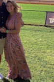This dress was the perfect outfit for the horse races. I bought my shoes off of Lulus as well (the ones she is wearing) and the length was perfect!  It was a bit big at the top but going down a size would've been too small. Beautiful dress, great material - although a lot of material.  Thanks Lulus for a great outfit! - Hannah A.