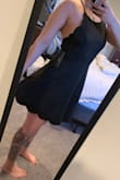 This dress is the most flattering dress ever. 
The ties adjust obviously and doesn't have to be super tight. 
Perfect little black dress or sexy red dress for date night. 
I would suggest steaming over ironing the fabric. 
It's not see through, not too short, I'm actually looking to purchase other dresses like this style bc it fit so well. Bought a M. - Ashley M.
