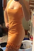 I love this dress and can't wait to wear it on my vacation this summer! I love the tassels and the color! Only complaint is that the straps are too lose on me and slide down when I am sitting certain ways but I have that problem with a lot of clothes! Other than that it fits perfectly!! - Alivia C.