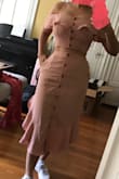 Fits well, though it's a bit too long for me. If you have curves like I do, A-Line dresses/skirts make me look frumpy because the bottom usually flares out on the sides - and this flares out on the bottom. Also the color doesn't suit my olive skin tone. Returning it because for $74 I want it to make me look amazing, and not so short and frumpy. - Elle T.