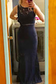 I initially ordered an xs which was way too tight in the rib cage. I then bought a small and it fit perfectly. I love the dress. Very elegant looking. - Amanda K.