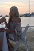 Love this dress!! Wore it for my bridal shower and on my honey moon. The back is adorable!! Open but you can still wear a bra and it won't be shown. - Regina R.