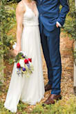 This dress was perfect for my wedding! Exactly the combination of simple yet elegant I was looking for. When I had it shortened, I had them leave a really small train in the back so it looked a bit more "bridal". I also had it taken-in at the waist because I wanted it to be tighter and to fit perfectly (if I had not done this it would have still been wearable). The quality is great considering its price - the dress skirt definitely has some weight to it. I'd also like to note that the color is slightly off-white, but you would only be able to notice when comparing it against something truly white. I feel like this is the type of dress that would be flattering on any body shape. Overall, this dress was worth it and I would definitely recommend! - Paige S.