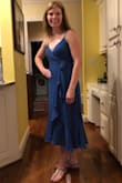 I ordered several Lulus dresses for a rehearsal dinner, and this one was the winner. I felt like it was very flattering in the stomach/hip area (this photo was taken after eating a huge dinner!). I wore a sticky bra, didn't feel comfortable going without and my regular strapless wasn't low-cut enough. If you have a bigger chest, consider sizing up. It is completely adjustable since it's a wrap dress with adjustable straps, so you can make it work for any body type! - Ashleigh S.