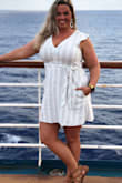 Loved the way this dress feels and fits. It has an elastic waistband in the back, which definitely helps if you have a wider waist. Wore this on my cruise and received many compliments. You could dress this up or down, I will be getting a lot of use out of this classic cute dress. - Jessica L.