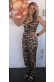 I love, love, love this jumpsuit! Very comfortable and fits true to size. I wore it to a bridal shower with a blazer and also wore it by itself out one night. I got lots of compliments. It is the BEST jumpsuit I own. - Doretta S.