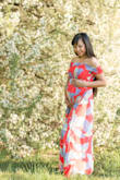Love love the dress. I used to wear size XS before I got pregnant. Now size M is perfect for me as I'm 22 weeks pregnant. - Nina R.