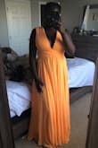 Dress is stunning and comfortable. I wanted a color to stand out on my skin and is much brighter than the photo, almost neon! - Thaddea A.