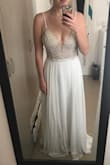 This will be my party dress at my wedding - I received it well in advance. It looks so much better in person, I'm so happy with this choice. The corset runs a little bigger, so I might have to take it in a little bit. It is long as mentioned with a bit of a train but highly recommend. I was originally going to go for a size 10 because my measurements are right in between an 8-10 but I figured I will lose a little weight and I ended up getting the 8 and its even a bit a big, so take that into consideration. Overall very happy! - Leorre F.