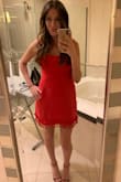 I was a little skeptical when I ordered this dress because it didn't have any other reviews and I wasn't sure I would like the tassels in person... but I'm so glad I ordered it!! I love the color! And the fit it perfect! Can be dressed down or up! My husband isn't a fan of red and when I pulled it out of the bag he made a face but he loved it when I put it on!! - Alexandra B.