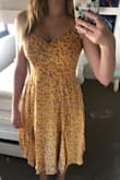The material is super comfy and the fit is very flattering. Perfect length as well! The colour is different than the pictures online - it's more orange-y than yellow in real life, but it's still a nice colour regardless. - Kate R.