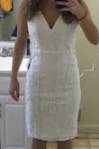 I didn't realize the dress was iridescent, but it is. It's also a bit loose in the chest area, too long, and tight by my knees. Not for me. It's too bad, the neckline was just the right amount of V. - Sara O.