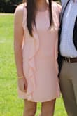 I wore this as my Easter dress and got so many compliments! It has a zipper under the left arm pit and has a nice figure to it. This is not a shift dress as it's fitted around the waist. I normally wear a true medium, and the medium was perfect. - Caitlyn P.