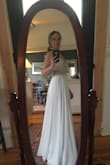 Very beautiful dress!! The bead work is very detailed and catches the light at night. I'm planning to wear this for a bohemian candlelit wedding in September, and I'm so excited. - Christina R.