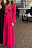 I hemmed this dress, and I'm 5'5". My 4.5" heels were not enough to keep this dress off the ground for a wedding. The color is vibrant (bright pink but not neon.) It is also a heavy, quality material! Might be too warm in the summer but it's a great dress for any other time of year. - Kristen