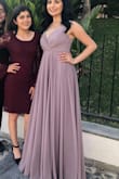 Fits true to size. I purchased this dress for a wedding and I loved it. It looks very "expensive" and good quality. Very comfortable and I love how the straps are adjustable. - Brenda I.