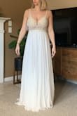 I returned this one. It was beautiful but made me look a little too chesty for my wedding day. It's really gorgeous and great quality. If cleavage is ok for you go for it! It actually has good support and I wouldn't have needed a bra which is a surprise consider my boobs are on the larger side - Caitlin G.