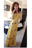 This dress must be a staple in everyone's closet for the summer! The length of the dress is perfect for me being 5'9", it barely brushed the floor. The fit is true to size, its easy to adjust anyways with it being a wrap dress. The material is very easy to iron and steam. The only thing that should be noted is that it is a little sheer, but a bodysuit underneath works perfectly!!! - Jessica B.