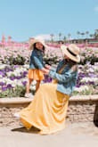 I got this in yellow and it was the perfect dress to wear the flower fields to match with my daughter. It was bright, airy and the perfect length. I wore flat shoes and am not the tallest, but it landed right at my feet. Usually maxis are super long even with heels, but this was perfect! I wore it with chucks and a denim jacket, but it can also be dressed up if I want. Just make sure to iron it out because it does get crinkled easily. But other than that, I love this dress. - Genny N.
