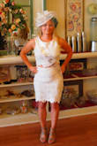 This dress was fitting for a taller person, so I had to have it altered to fit me. The bottom of skirt was hemmed and top was taken up a bit. Glad I did cause it looked even better on me. Perfect for being conservative yet showing a little skin for someone with a wild side. It matched my personality, and I wore it to my tea party themed bridal shower. Got lots of compliments!! Wish it was available in petite sizes though. - Michelle B.