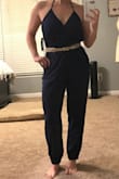 I was definitely nervous when I ordered this considering the halter cut and jumpsuits tend to be hit or miss for me. I'm glad I ordered this one though! The front is covered enough that you can wear a strapless backless (read: sticky) bra with it, though I'm not wearing one in the picture. It's definitely not tight enough to hold your girls in place, at least not for me. I would beware if you have a long torso - I don't, and it was almost a borderline camel-toe situation for me. I loosened the halter a bit though and that fixed the issue. This will definitely be a summer staple for me! - Allison P.