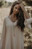 I wore this dress for my senior photos and loved it! The color really compliments brunettes & went well with strappy brown sandals. I also dressed it up later that fall and wore it to a wedding. Very versatile. Highly recommend! - Dara S.