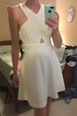 Cute dress, but it runs big in the bust. It would look awkward if I didn't pull it down to make it look more fitted. If you wear a B cup and up though, it would probably work. It is an elegant design- I wish it fit me better. - Elise G.