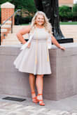 Ordered this dress for graduation pictures. It is much thicker material than I expected but it really is quality. The grey is also a little purple or blueish tinted but still very pretty. With a larger chest I was worried about the dress zipping up all the way since it is high necked but I had zero problems. Highly recommend this cute little dress. - Haley W.