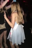 I got this dress for my bachelorette party and it was perfect! Super cute back and it fit me well. You can't really wear a bra with it, but petals worked for me. One negative is that by the end of the night the neck of the dress had rubbed and irritated my neck a little in the front. Other than that I love it! - Amy B.